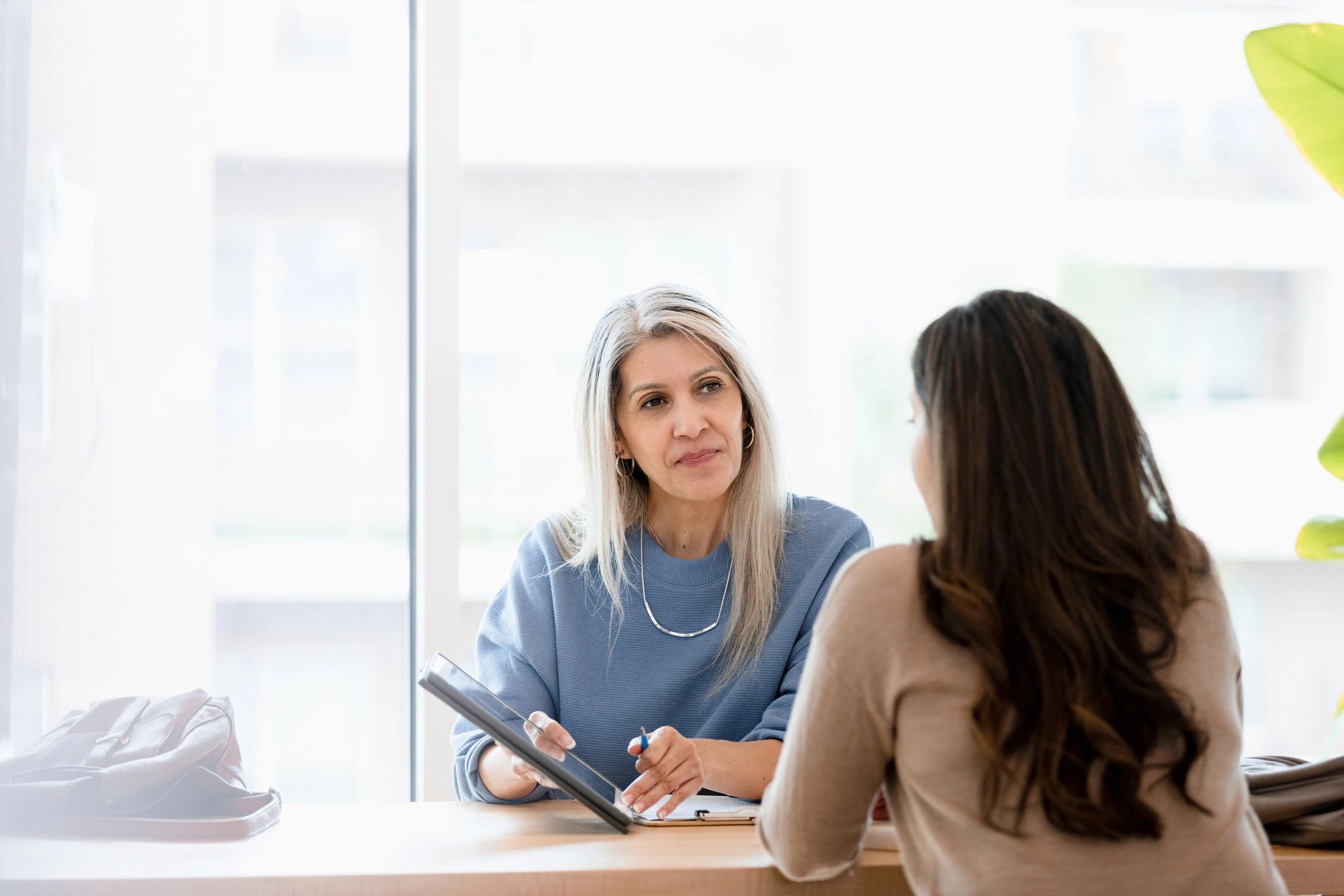 Homebuyer meeting with a mortgage advisor to review loan options