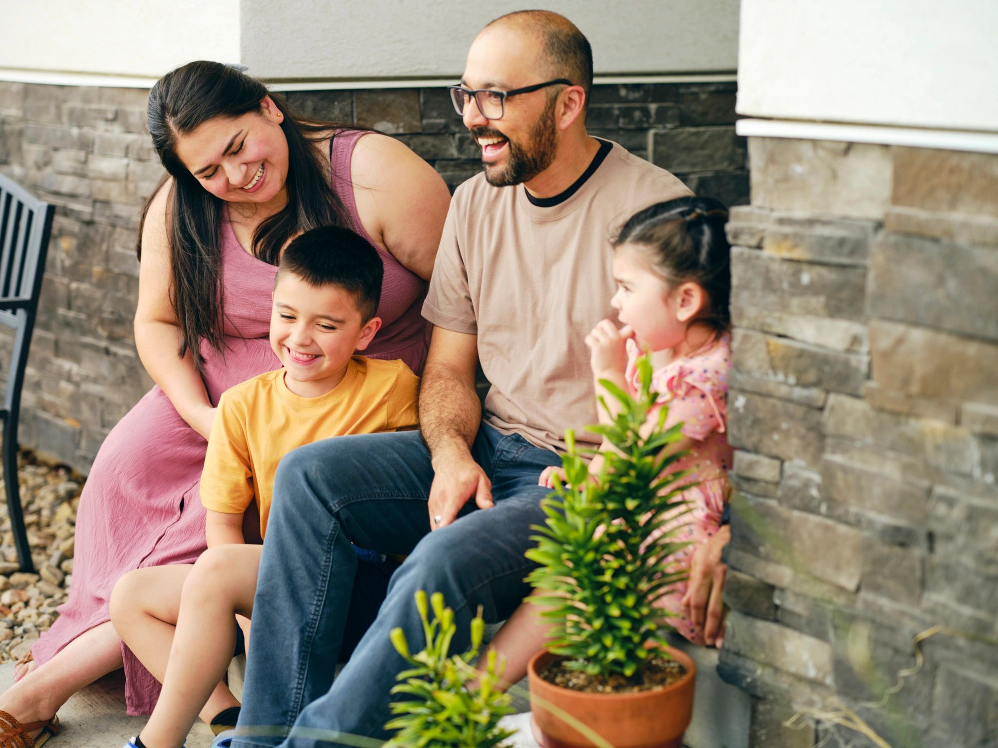 Family standing outside their home representing VA homeownership benefits